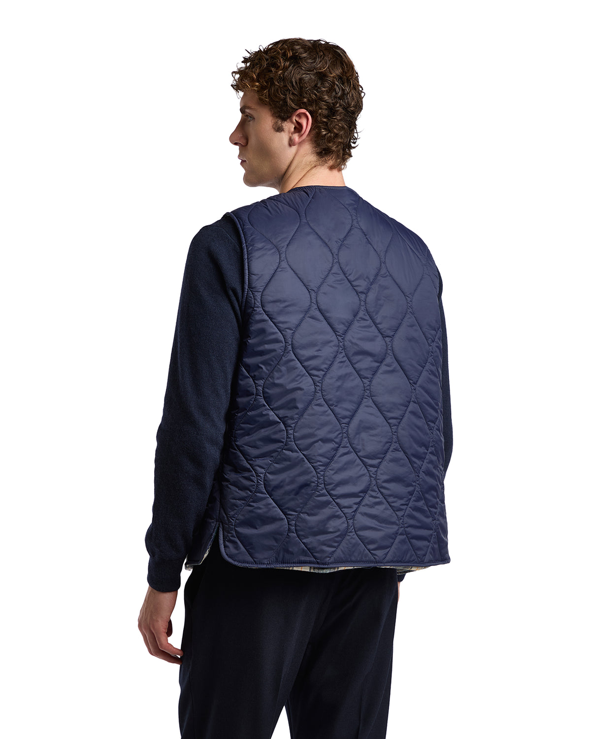 Navy blue quilted vest for men, featuring a classic design and lightweight fabric, perfect for layering.