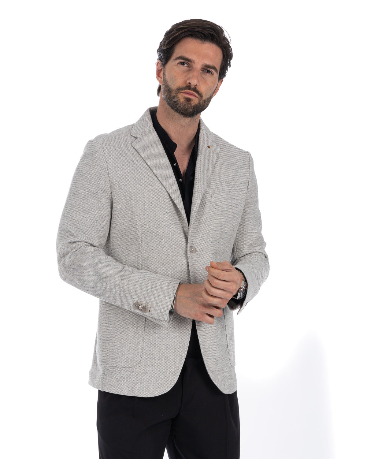 Light gray textured wool blend blazer for men, single button, notched lapel, paired with black shirt and trousers.