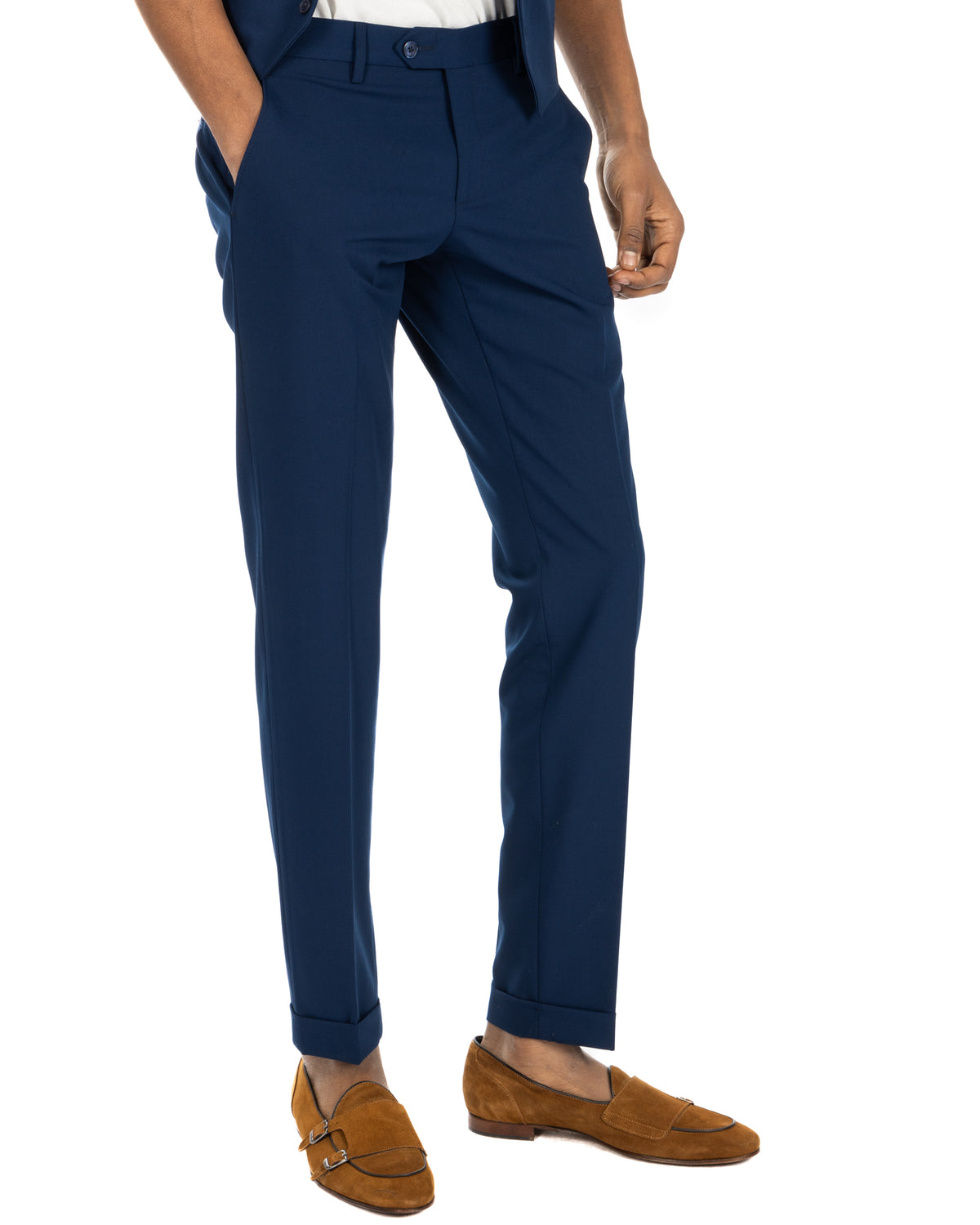 Navy blue slim fit wool dress pants with cuffed hems, paired with tan suede double monk strap loafers.