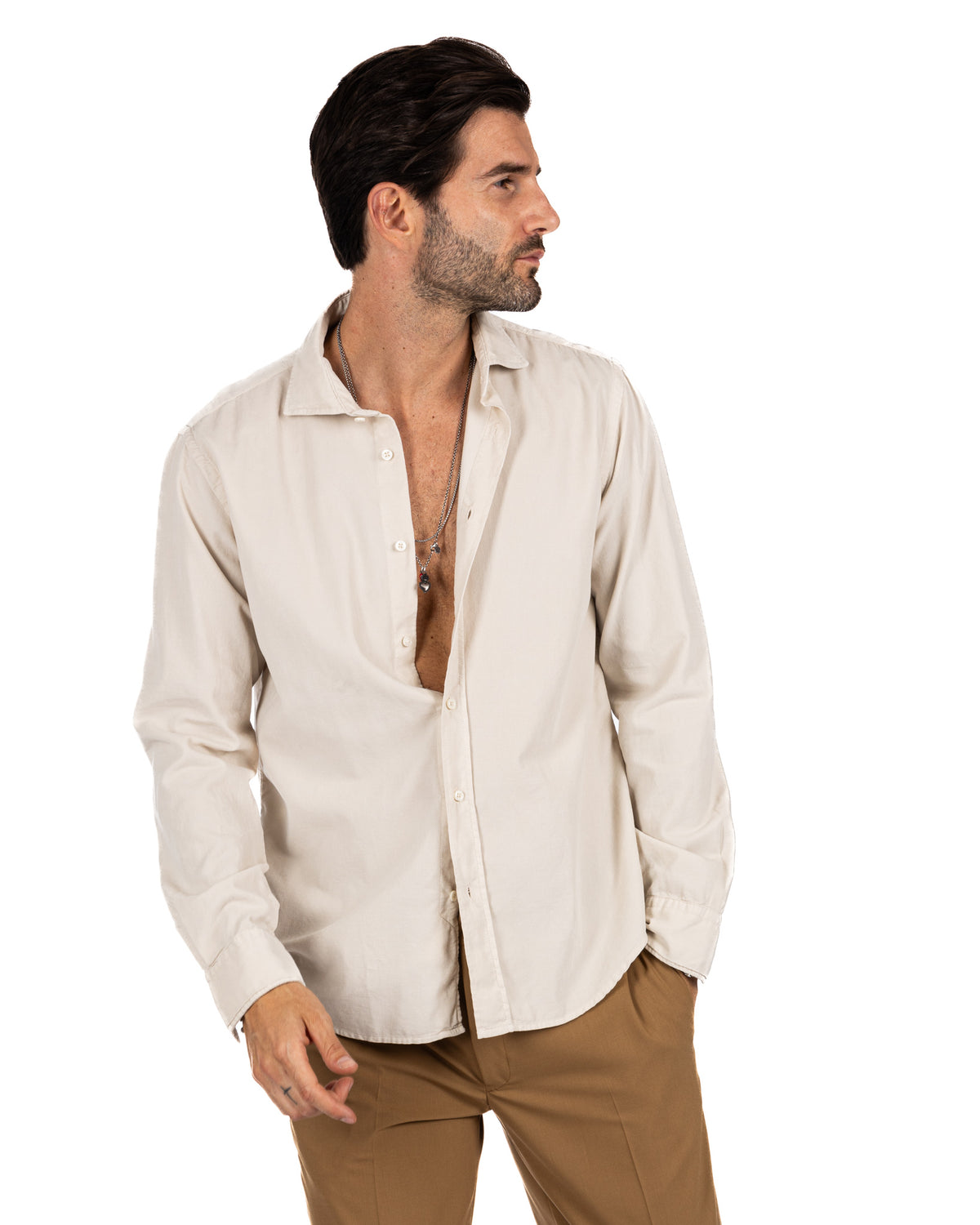Men's cream linen button-down shirt with relaxed fit, long sleeves, and spread collar. Casual summer style.