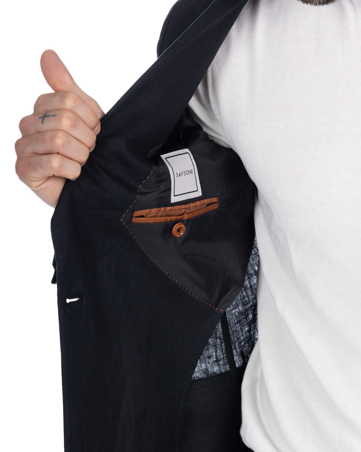 Black blazer interior with brown leather pocket trim, white SAVEONE label, and contrast stitching detail.