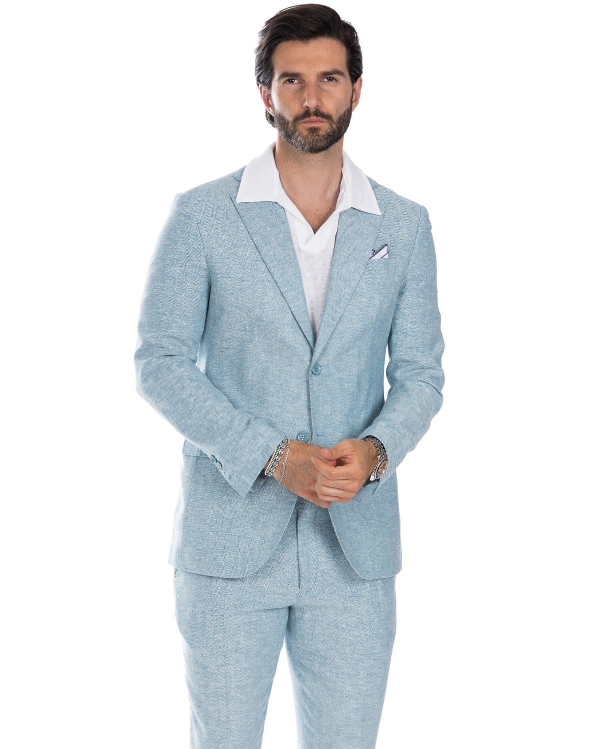Light blue herringbone wool suit with white shirt, tailored fit, two-button jacket, pocket square, men's formal wear.