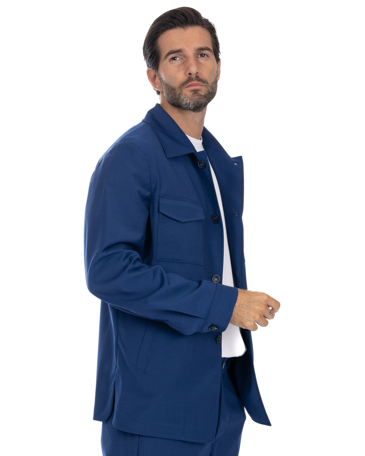Navy blue cotton twill men's chore jacket with button front, patch pocket, and notched collar. Casual workwear style.