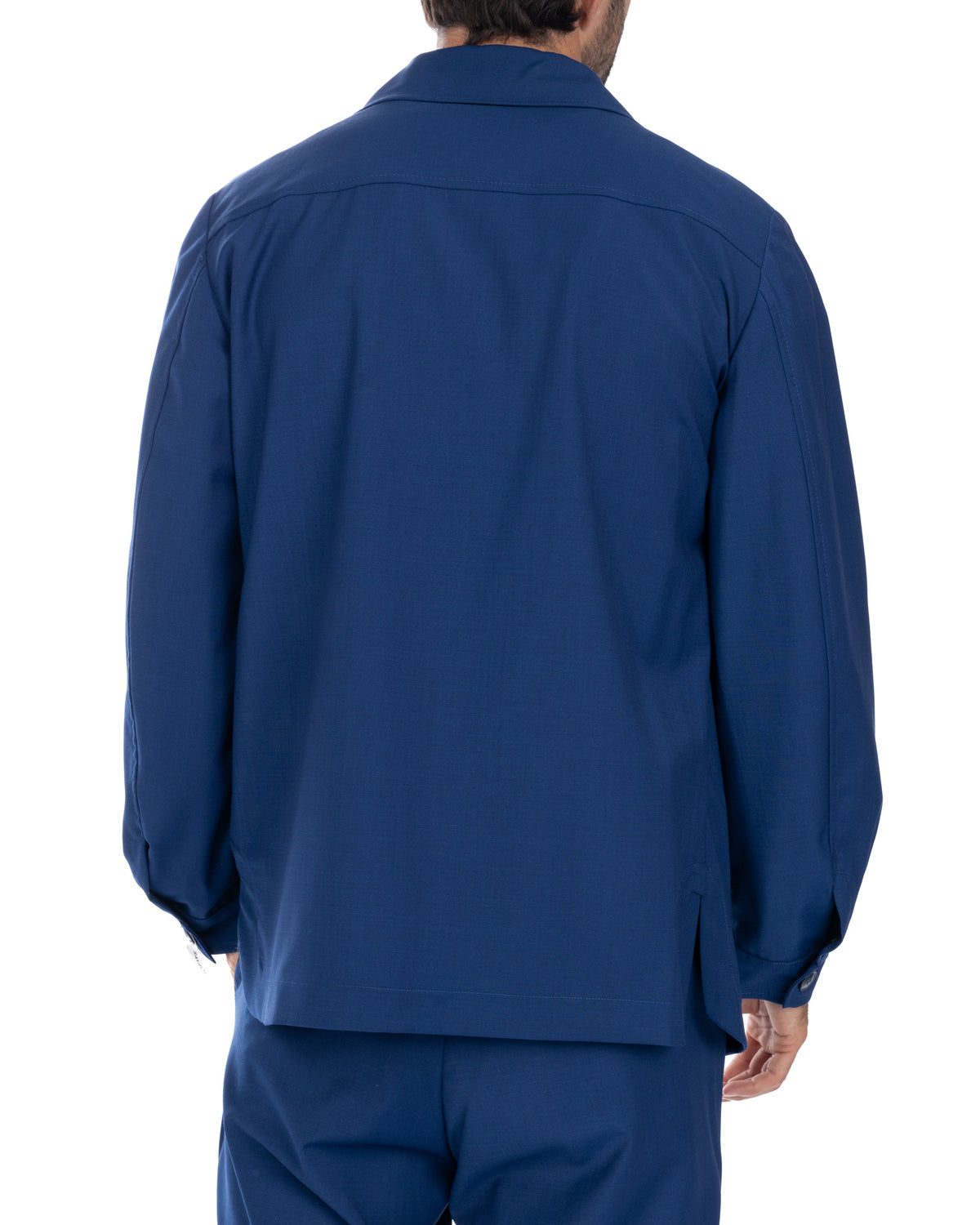 Navy blue men's suit jacket back view, tailored fit, long sleeves with button cuffs, formal business wear.