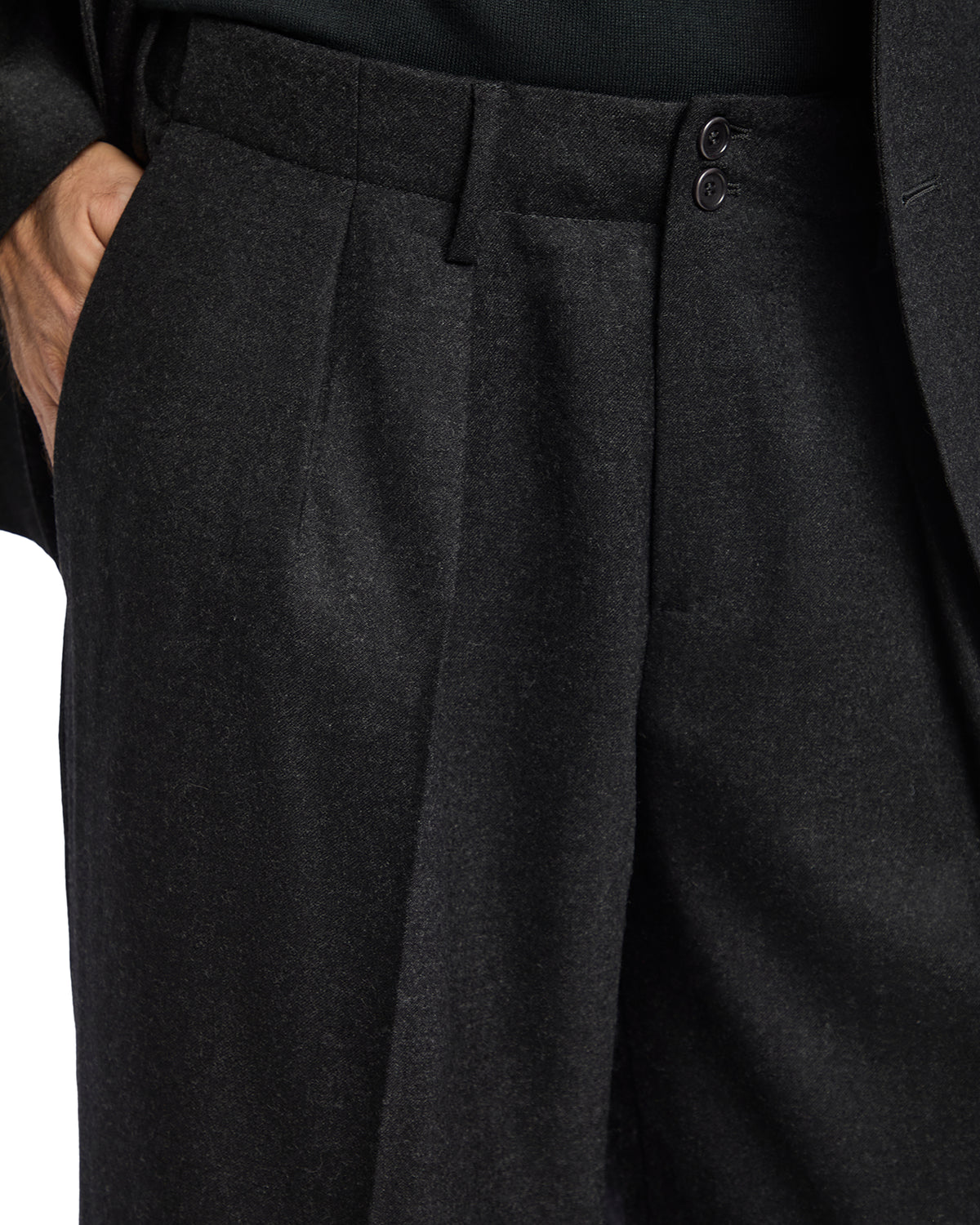 Men's charcoal gray wool blend suit pants with double pleats and button closure. Perfect for formal occasions.