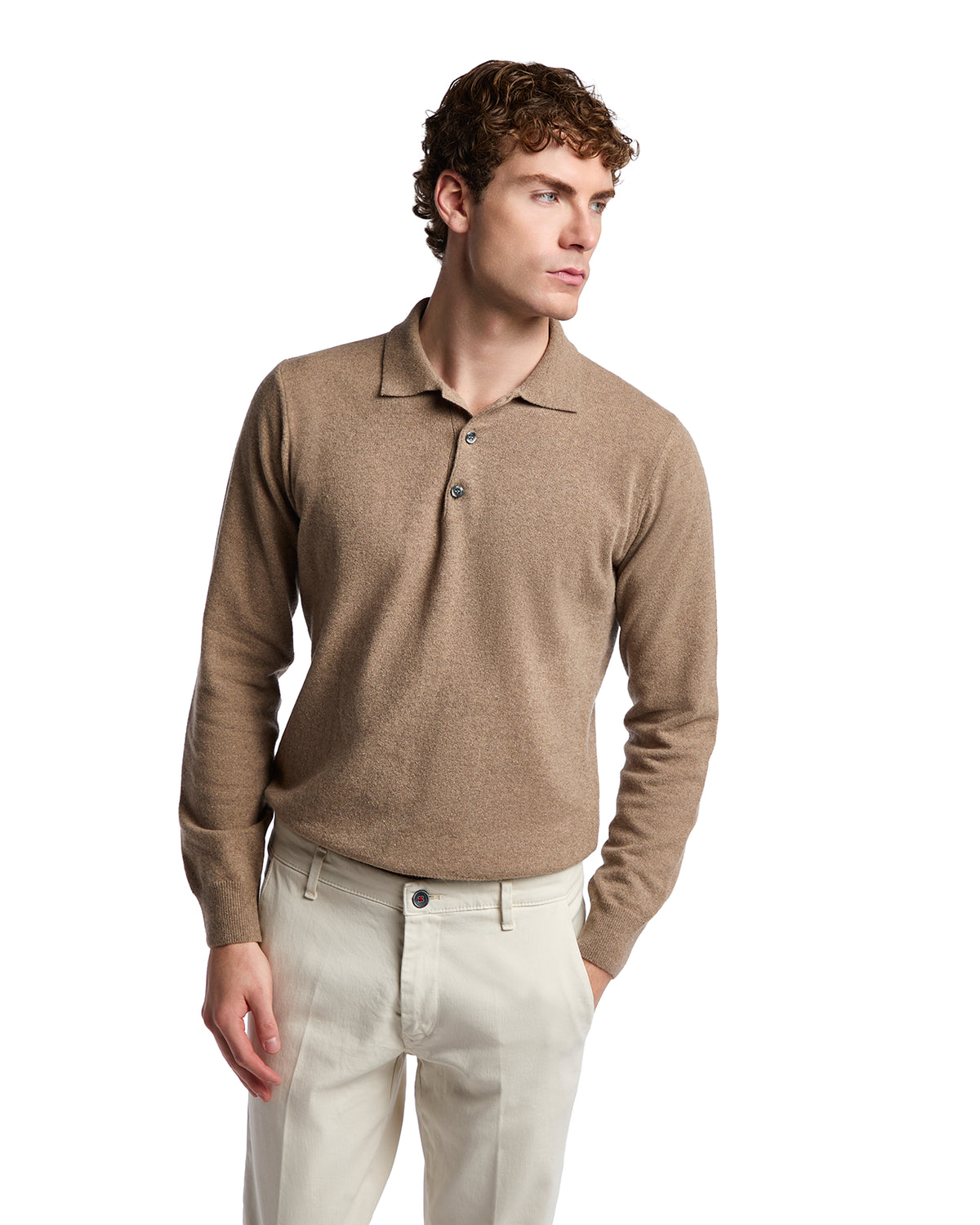 Brown cashmere polo shirt with long sleeves and button placket, styled with light beige trousers.