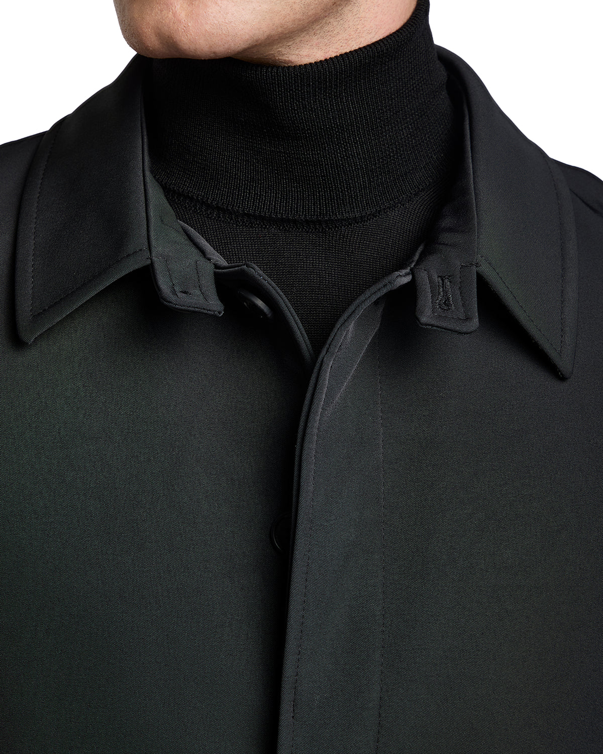 Men's black trench coat with sleek collar and soft knit turtleneck, crafted from high-quality materials for a modern look.