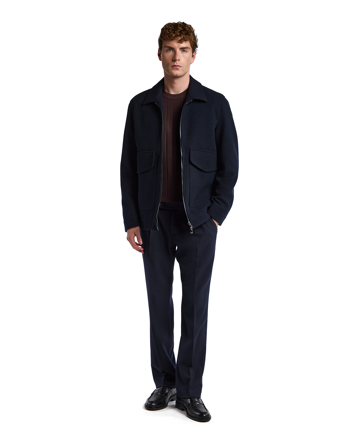 Men's navy wool blend zip-up jacket with two pockets, paired with dark trousers for a modern look.