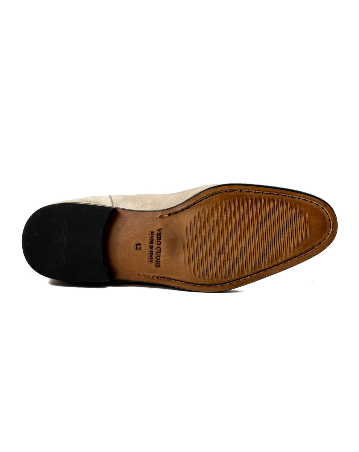 Beige suede dress shoe sole with leather accents and textured grip, perfect for formal occasions.