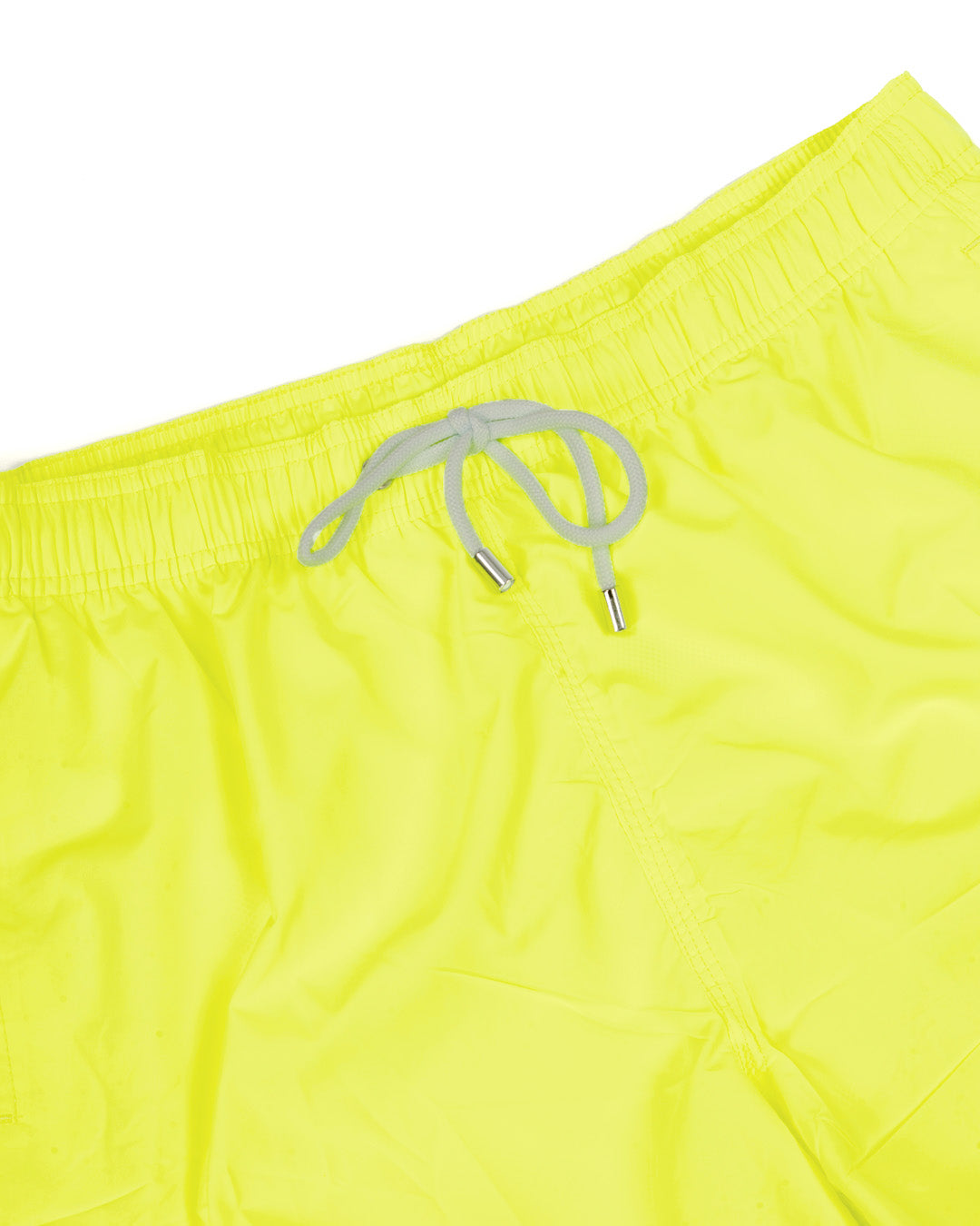 Neon yellow swim trunks with elastic waistband and gray drawstring, perfect for beach or pool days.