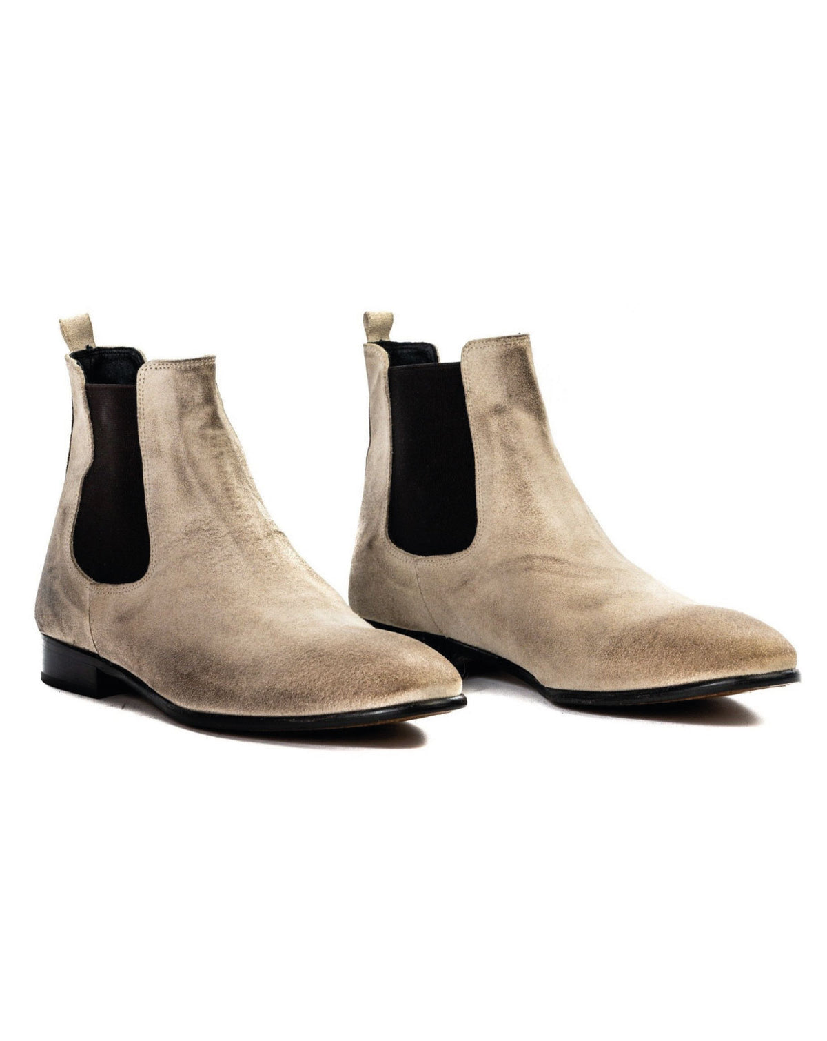 Beige suede Chelsea boots with black elastic side panels and sleek pointed toes. Perfect for casual or formal wear.