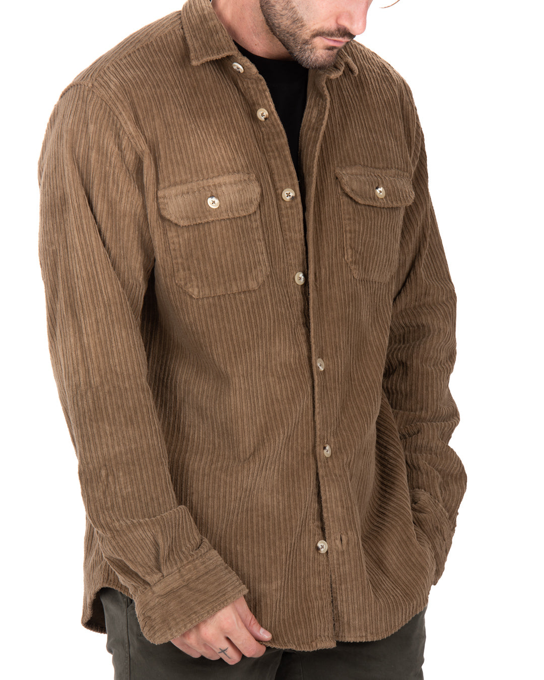 Brown corduroy button-up shirt with two chest pockets, relaxed fit, perfect for casual layering.