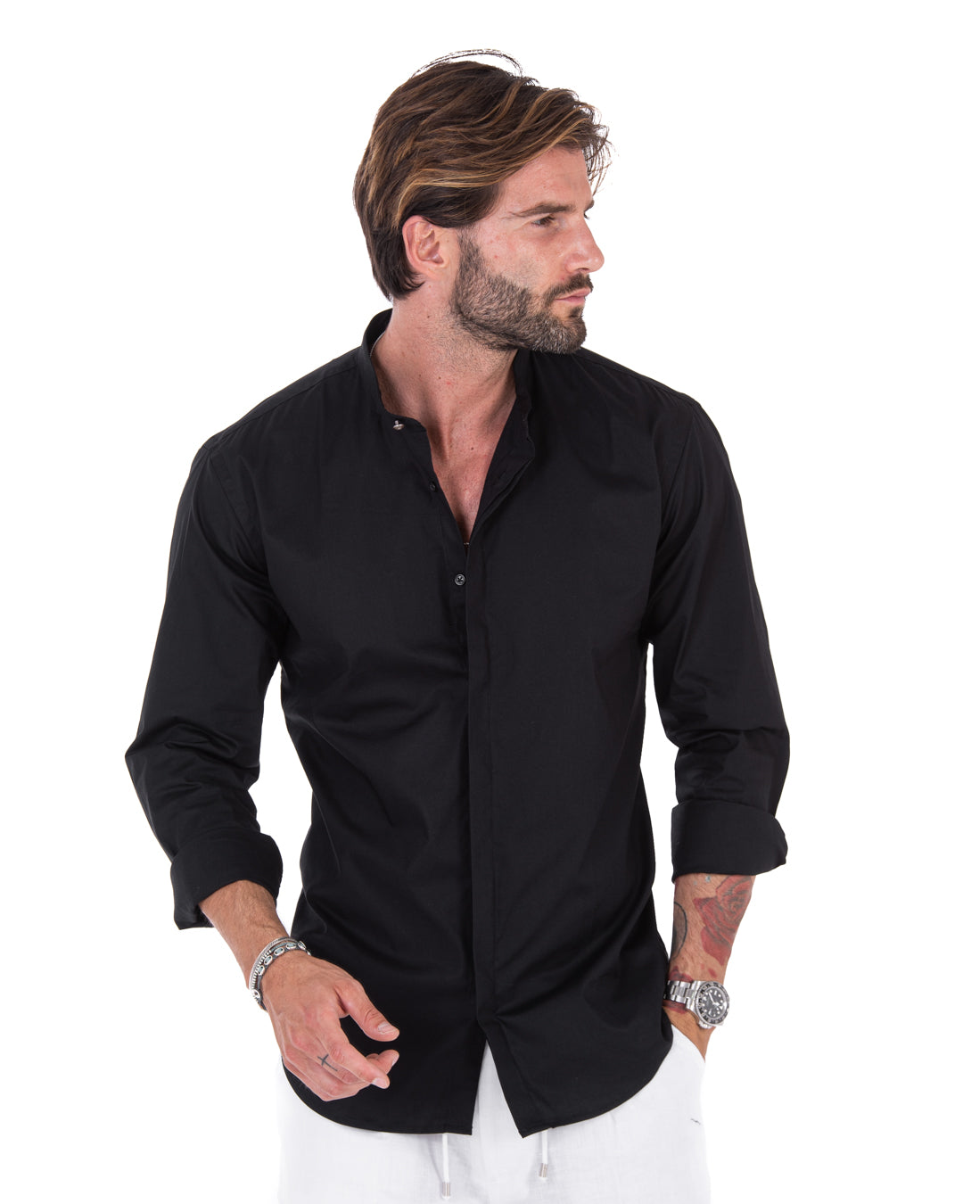 Men's black band-collar shirt with sleeves rolled, shown in three-quarter view on a model
