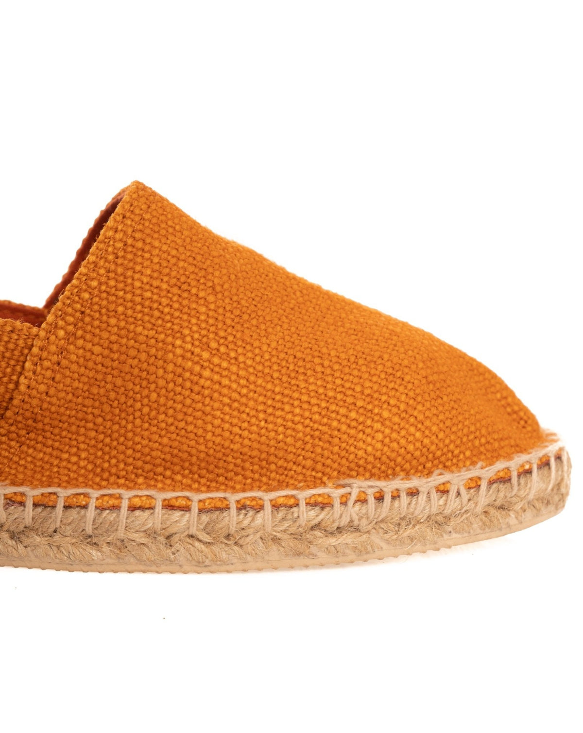 Close-up of an orange canvas espadrille toe with braided jute sole