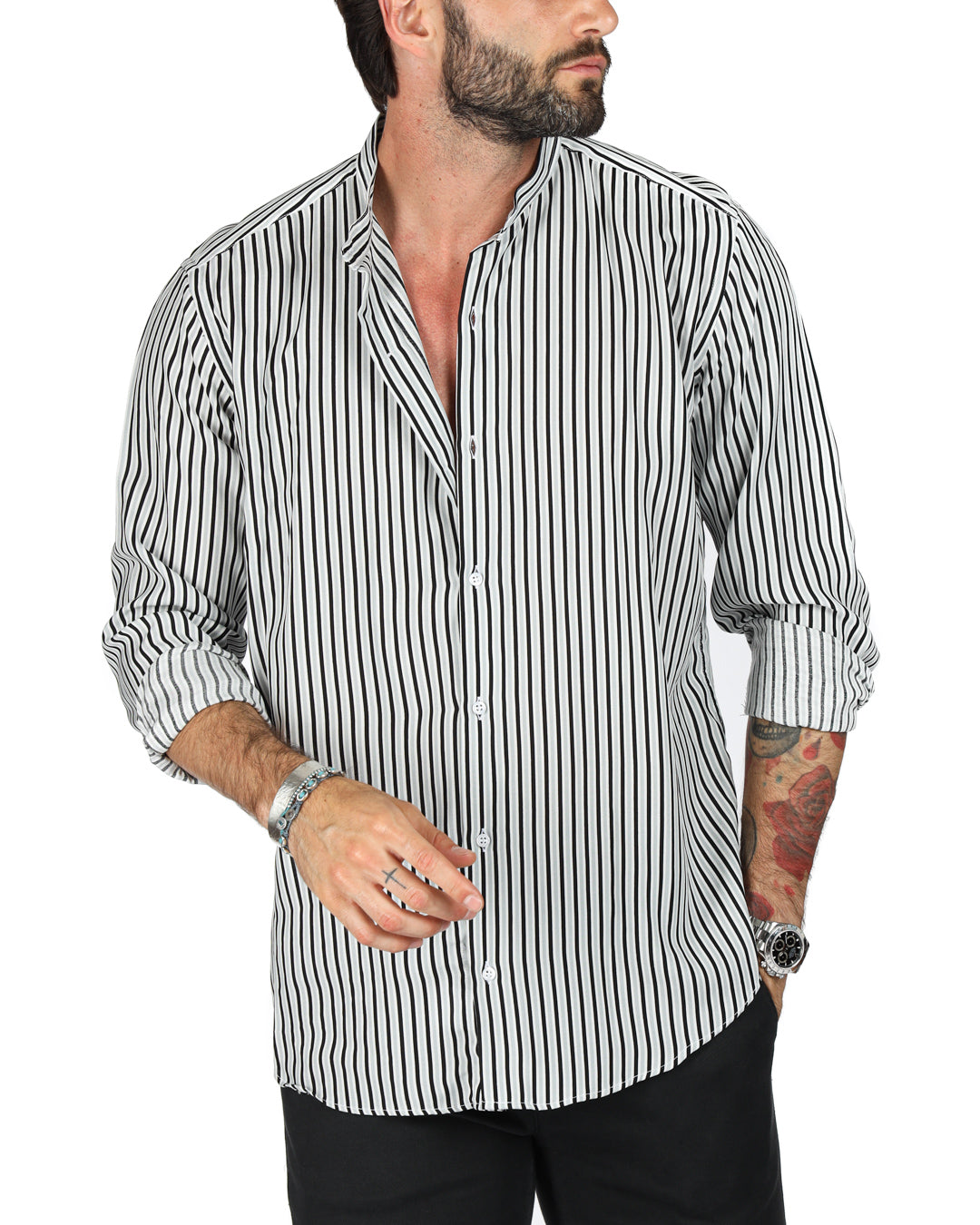 Close-up of a men's black and white striped shirt with band collar, worn open at the neck on a model