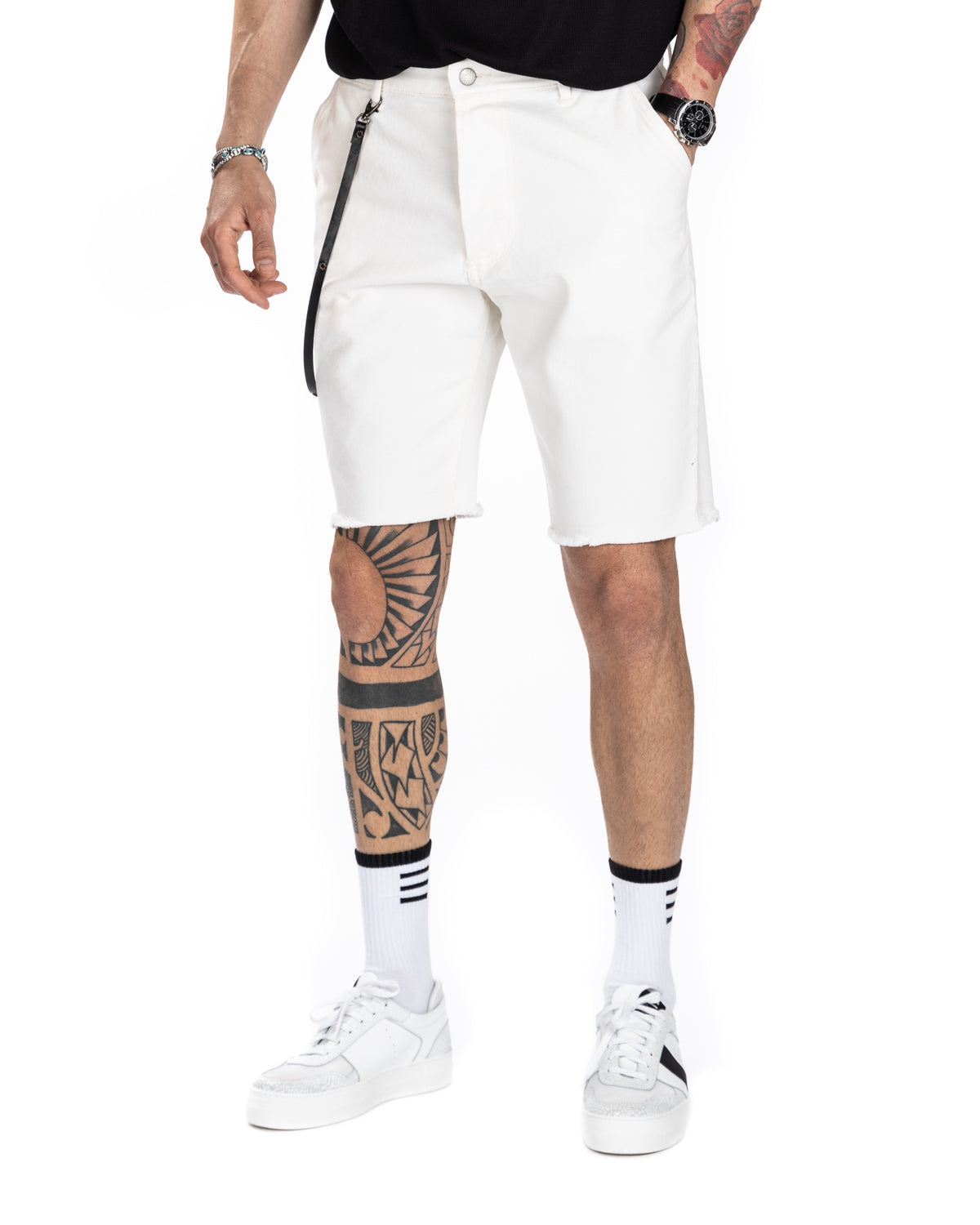 Men's off-white denim Bermuda shorts with raw frayed hem, shown from behind on a model