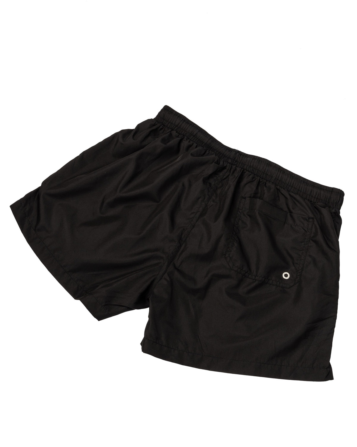 Black swim shorts with elastic drawstring waist, side pockets and back welt pocket, laid flat