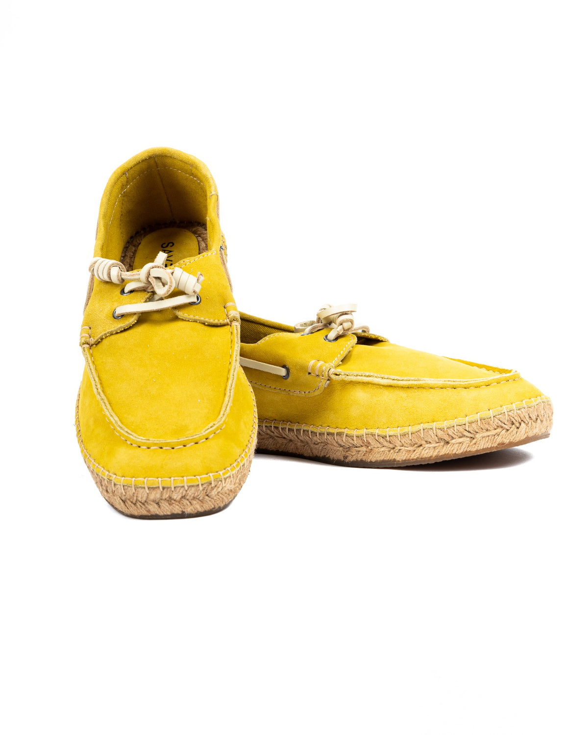 Pair of yellow suede boat shoes with leather laces and woven jute soles, shown on a white background