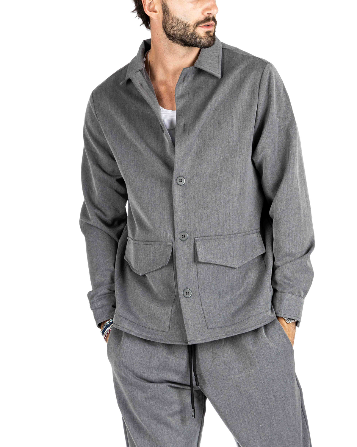 Men's heather gray overshirt jacket with flap pockets and gray buttons, shown on a model