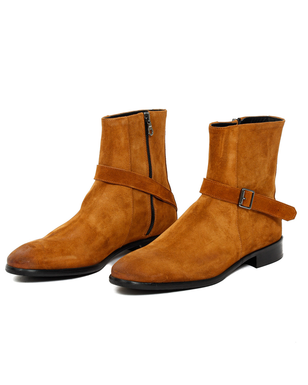 Pair of tan suede ankle boots with buckle straps and side zippers, shown at an angle