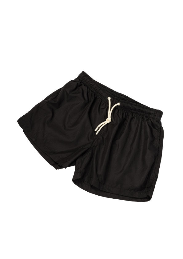 Black swim shorts with elastic waistband and white rope drawstring, laid flat on a white background